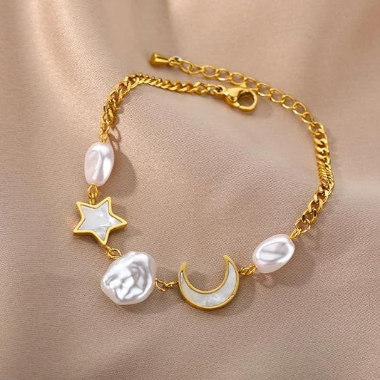 Gold bracelet featuring moon and stars.
