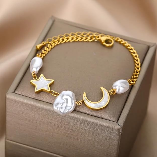 A gold bracelet with moon and stars design.