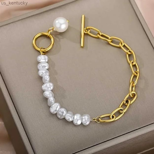 Stylish gold chain bracelet adorned with white pearls, perfect for a classy look.