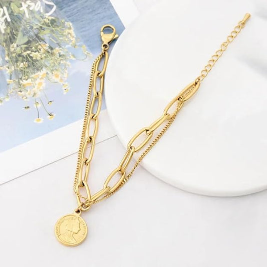Stylish gold bracelet with coin charm, ideal for adding a hint of sophistication.