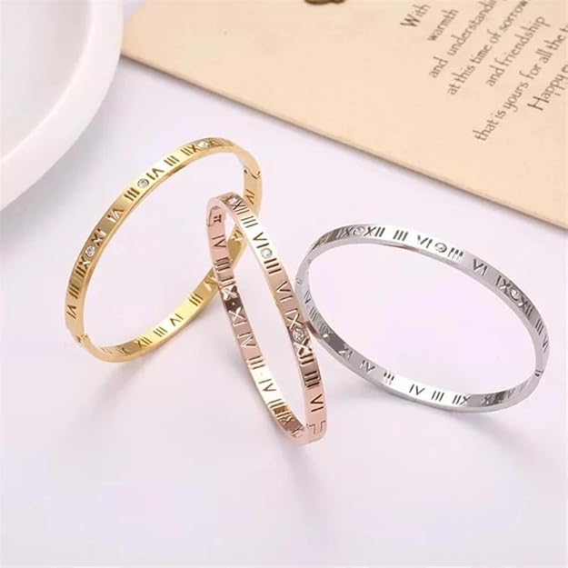 Fashionable gold bracelet engraved with Roman numerals.