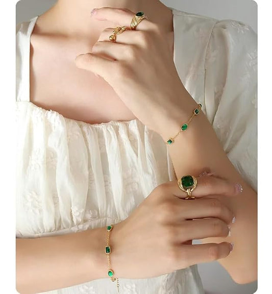 Stylish gold bracelet adorned with beautiful green stones, a must-have accessory for any occasion.