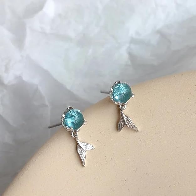 Sterling silver mermaid earrings with blue topaz stone.