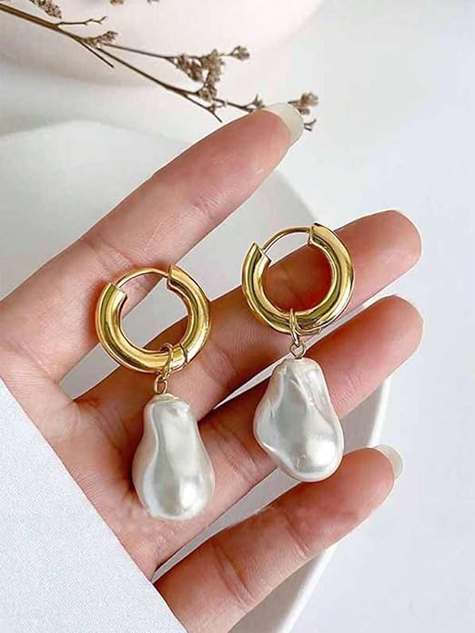 Stylish gold hoop earrings featuring beautiful white pearls, ideal for any special occasion.