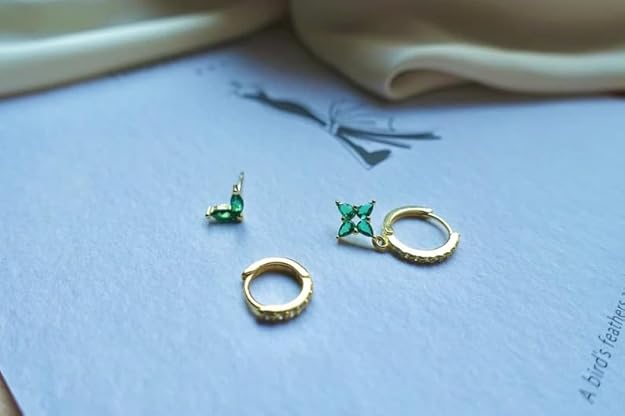 earrings and a butterfly charm.