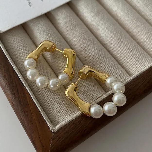 Elegant pearl hoop earrings, perfect for adding a touch of sophistication to any outfit.