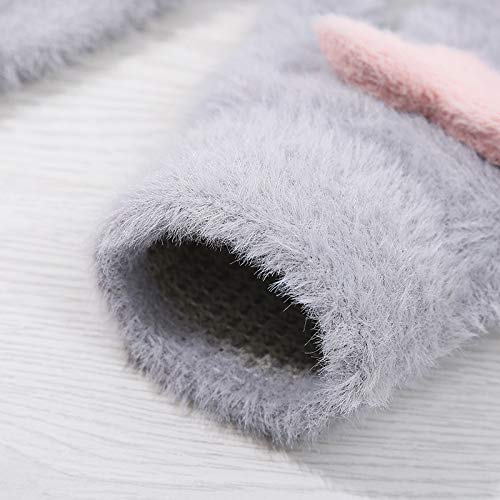 Two pairs of heart-patterned gloves, combining warmth and whimsy, perfect for cozying up on a chilly day.
