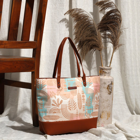 A spacious tote bag adorned with a colorful, patterned design, ideal for stylish and practical use.