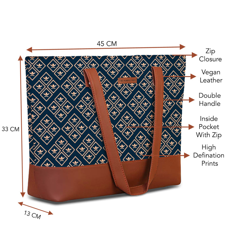 A trendy blue and tan patterned bag with durable brown handles, designed for both functionality and style.