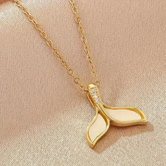 Gold plated necklace with a small gold fish pendant.