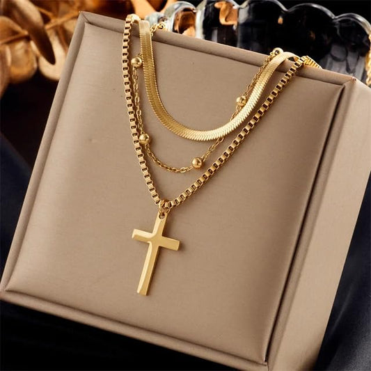 Stylish gold cross necklace on a delicate chain, elegant and timeless.