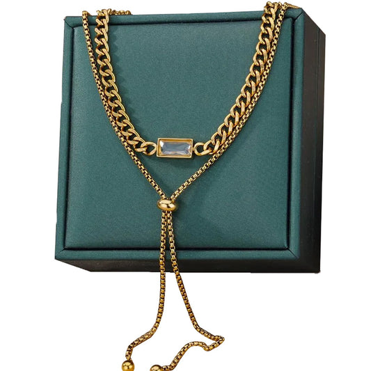 Luxurious gold chain necklace displayed on a soft satin cloth.