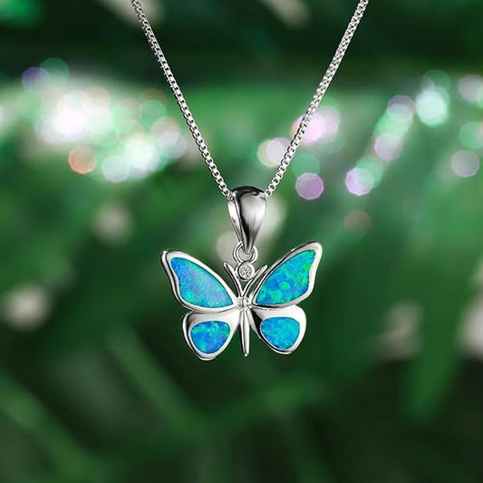 An elegant butterfly pendant adorned with blue opalite, highlighting its beauty and craftsmanship.