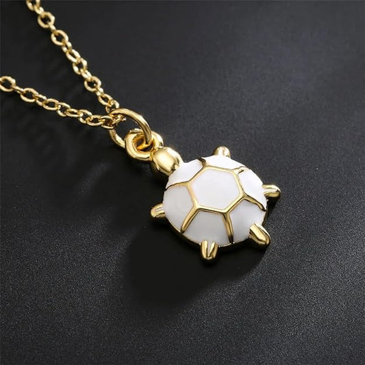 Elegant gold plated turtle necklace featuring white enamel, a stunning accessory for any occasion.