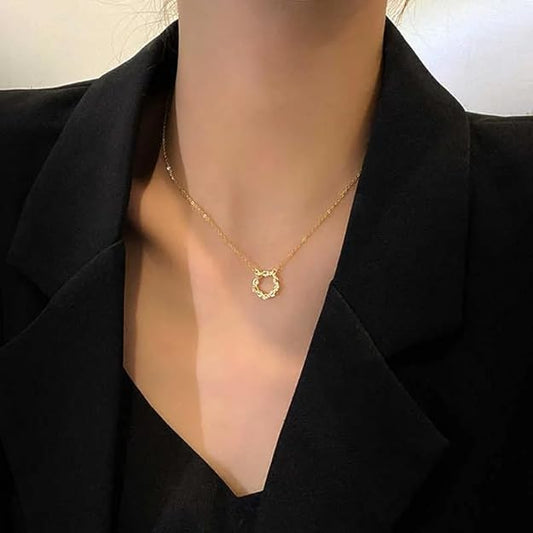 A circle design gold necklace.