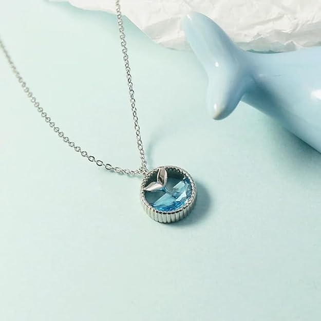 Blue whale pendant on silver chain, perfect for ocean lovers.