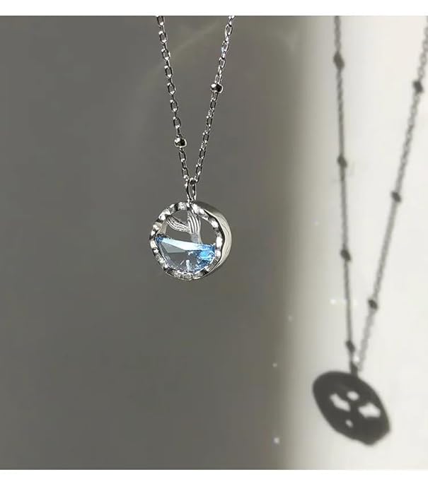 Elegant blue whale necklace with a shiny silver chain.