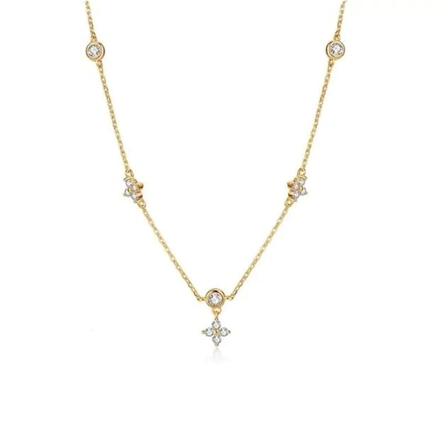 Elegant gold necklace with shimmering white diamond embellishments.