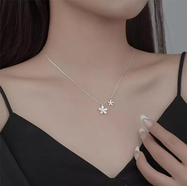 Silver necklace with a beautiful floral accent.