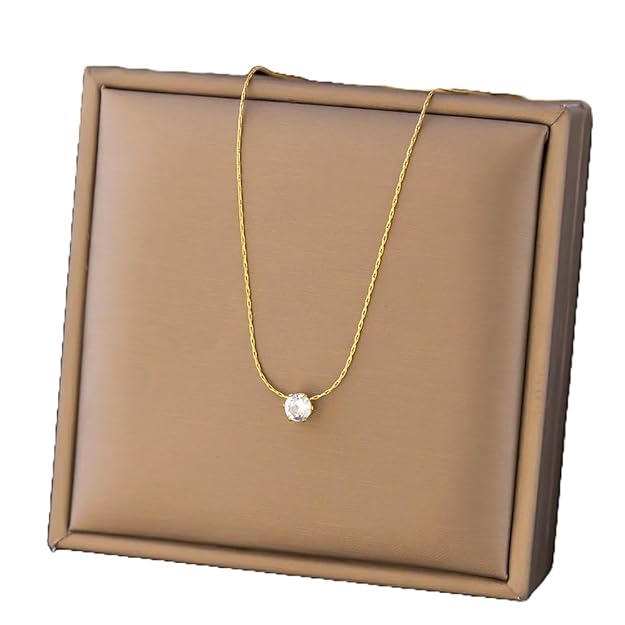 Stunning white diamond set in a gold plated necklace, exuding luxury.