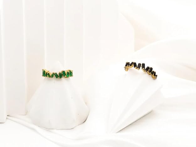 A beautiful gold and black diamond ring, a timeless and elegant addition to any jewelry collection.