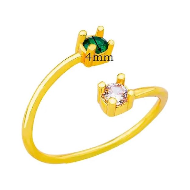 Beautiful gold ring featuring two green gemstones.
