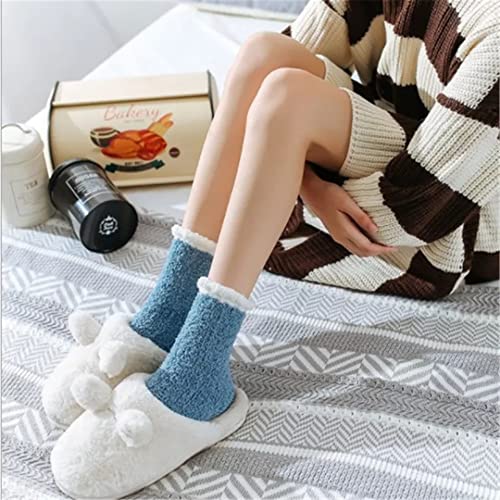 A cozy pair of blue socks featuring a stylish white trim, perfect for keeping your feet warm and fashionable.