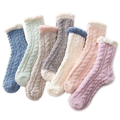pair of light green socks featuring a stylish white trim, perfect for adding a pop of color to your outfit.