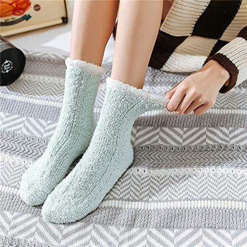 A woman relaxes on a cozy blanket, sporting a cute pair of colorful socks.