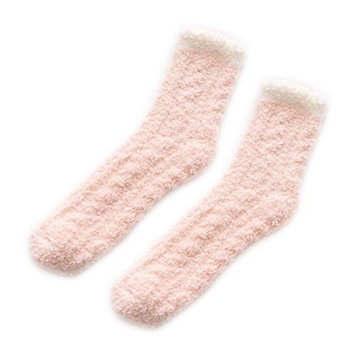 A pair of cozy pink socks resting on a clean white background, perfect for adding a pop of color to your outfit.