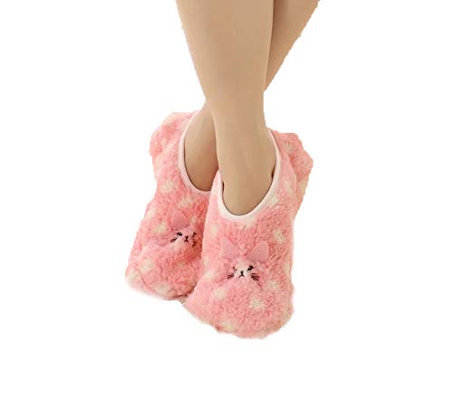 A woman's feet in cozy pink fuzzy slippers, illustrating a warm and inviting home setting.