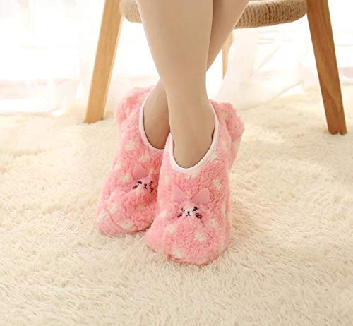 A woman's feet comfortably resting in soft pink fuzzy slippers, showcasing a cozy and relaxed atmosphere.