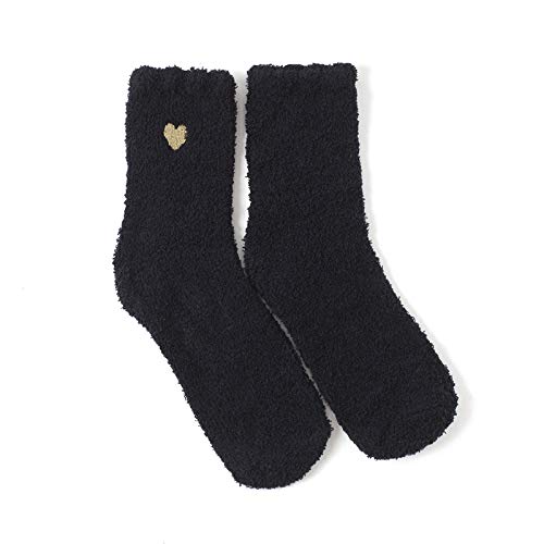 A pair of black socks featuring a gold heart design on the side, perfect for adding a touch of charm to your outfit.
