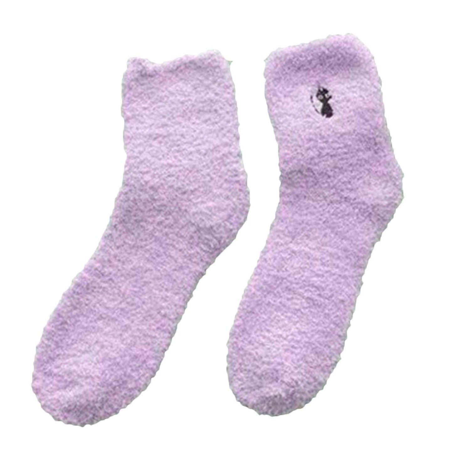 A pair of cozy purple socks featuring a cute cat design, perfect for keeping your feet warm and stylish.