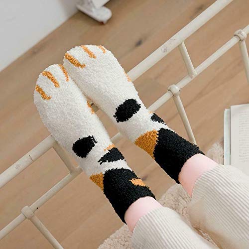 Adorable socks adorned with black and white cat paw designs, ideal for adding a fun touch to your outfit.