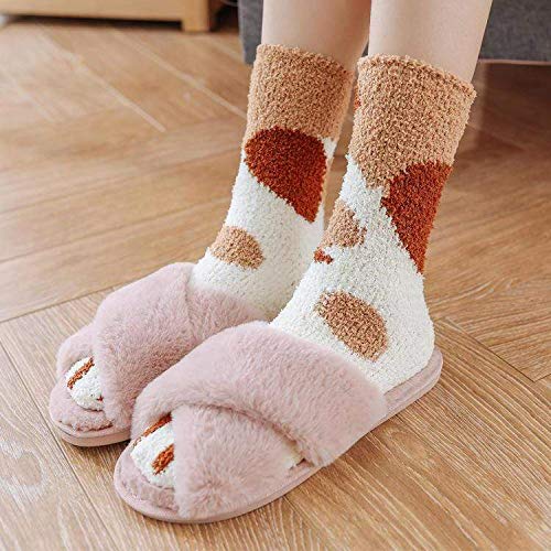 A pair of socks featuring a playful cat print, showcasing a whimsical design perfect for cat lovers.