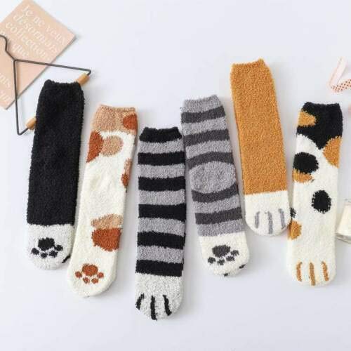 Cozy socks adorned with a charming cat print, ideal for adding a touch of fun to your wardrobe.