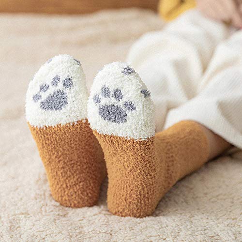 A set of whimsical cat socks laid out on a white surface, emphasizing their fun design and bright colors.