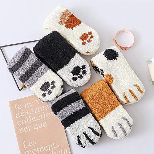 Cute cat socks resting on a clean white surface, perfect for cozying up at home.
