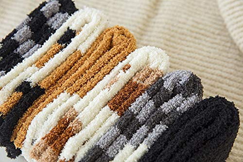 A pair of black and white striped socks laid out flat, showcasing their bold pattern and cozy fabric.