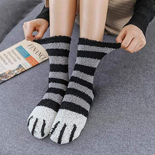 A pair of socks featuring a bold design of alternating black and white stripes.