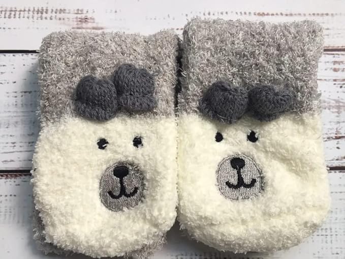 A pair of soft gray socks showcasing a playful bear face, perfect for snuggling up at home.
