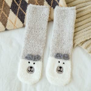 A cozy pair of gray socks featuring an adorable bear face design. Perfect for keeping your feet warm and stylish!