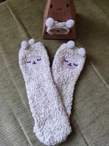 Two pairs of cute socks featuring adorable cat faces, perfect for cozying up at home or adding fun to your outfit.