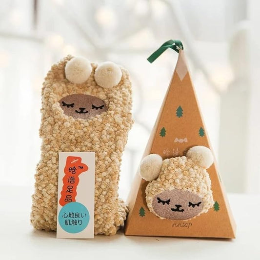 A delightful image of two pairs of socks adorned with playful cat faces, ideal for cat lovers and comfy wear.