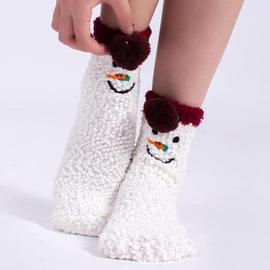 A delightful display of two pairs of socks adorned with playful snowmen, ideal for the holiday season.
