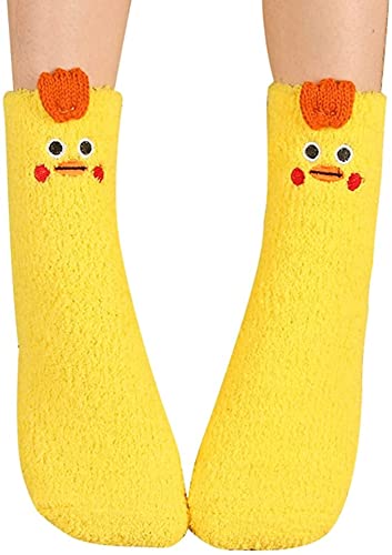 A woman’s feet in cheerful yellow socks with charming chicken faces, perfect for adding a quirky flair to her style.