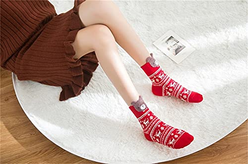 A colorful display of Four pairs of socks adorned with playful reindeer and Santa Claus, ideal for Christmas cheer.