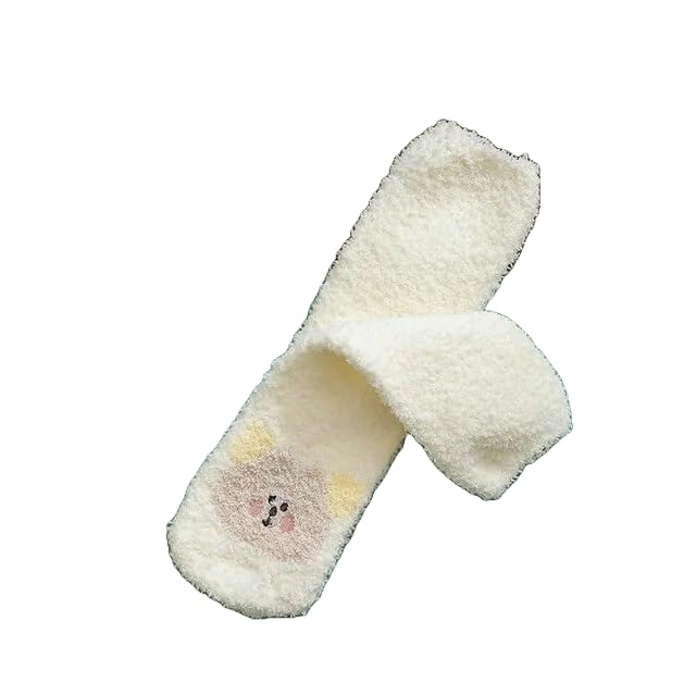 A pair of socks displayed alongside two pairs of scissors, highlighting a unique and playful arrangement of items.