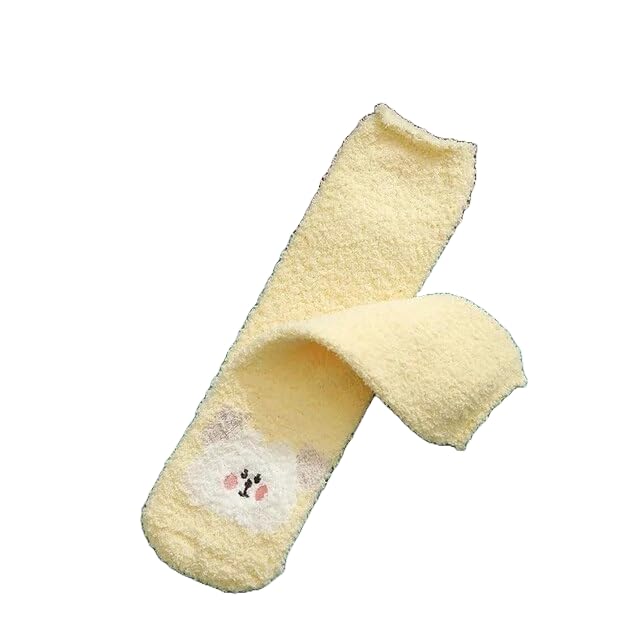 A pair of socks displayed alongside two pairs of scissors, showcasing a unique and playful arrangement.